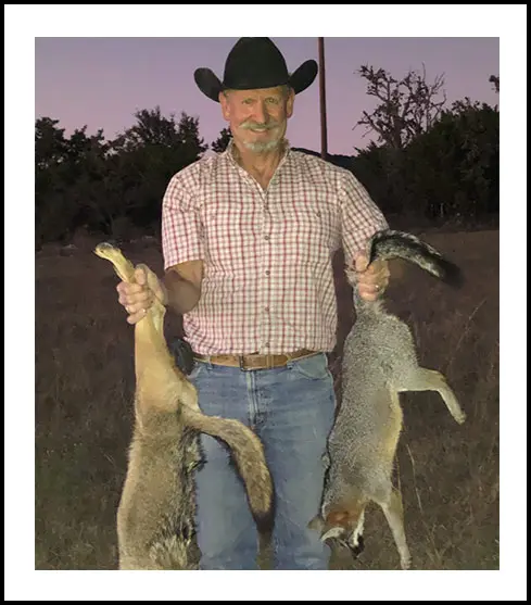 Man carry fox at Mobley Ranch Dilley, Texas