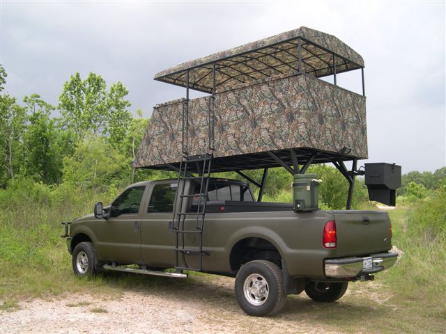 A safari truck parked in a forest